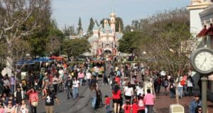 Guests on Main Street, U.S.A., at Disneyland Park.