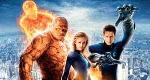 Four superheroes from the MCU pose on a city rooftop: a flaming man, a rock-skinned figure, a blonde woman, and a man in blue with stretching arms, all in blue suits bearing the number 4 emblem. The city skyline stretches behind them.
