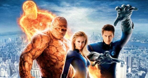 Four superheroes from the MCU pose on a city rooftop: a flaming man, a rock-skinned figure, a blonde woman, and a man in blue with stretching arms, all in blue suits bearing the number 4 emblem. The city skyline stretches behind them.