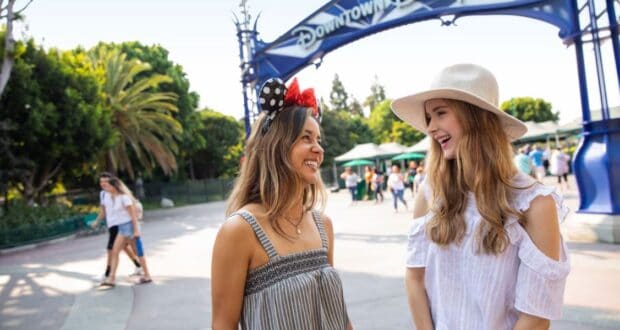 Two young women outside the entrance of Downtown Disney