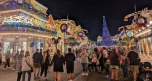 Magic Kingdom Park's Main Street, USA, at night, during Christmas.