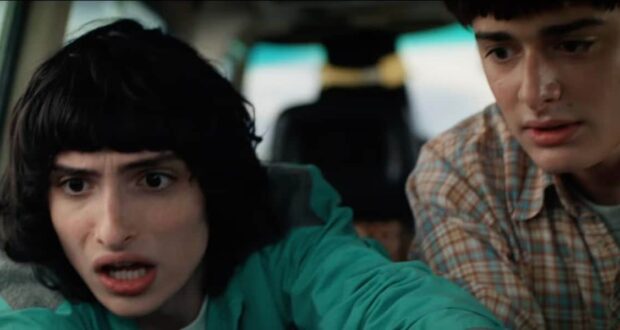 Two teens in a car appear nervous, capturing the suspenseful vibe of Stranger Things Season 5 as seen at Universal Studios.