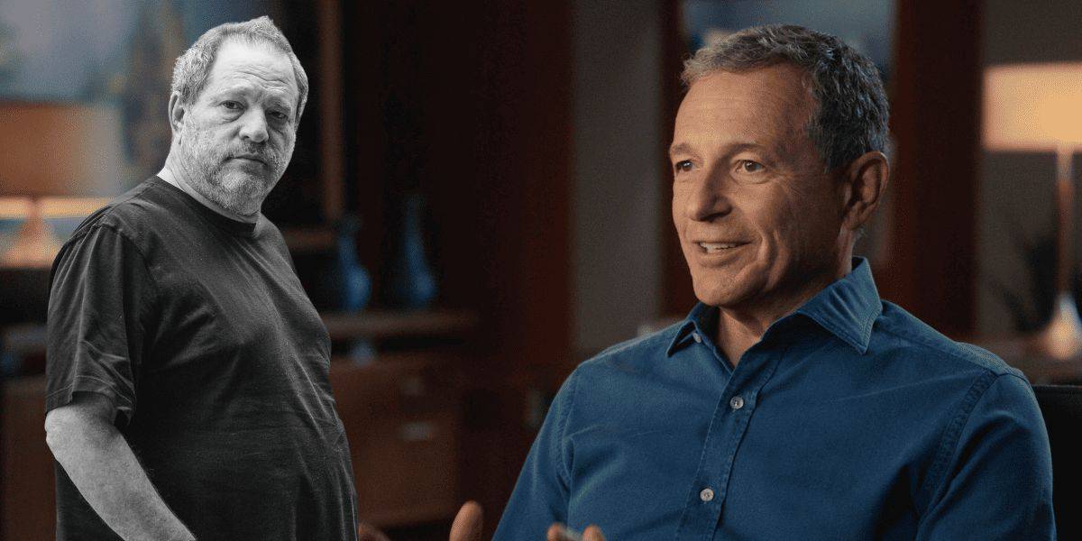 Two men indoors, one in a black tee standing, the other seated in a blue shirt, sharing Disney magic with bright smiles.