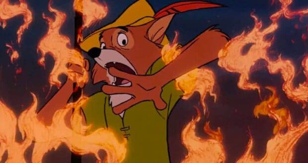 Robin Hood, in his signature green shirt and hat, appears startled as flames blaze around him during the parade spectacle.
