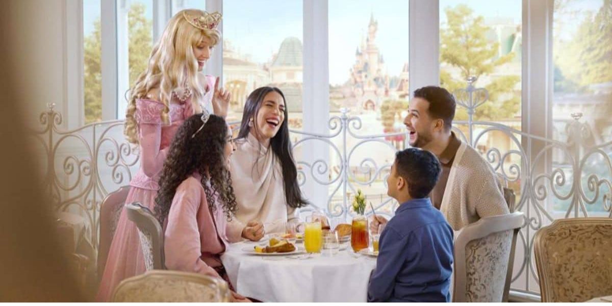 Guests with Sleeping Beauty inside Disneyland Hotel