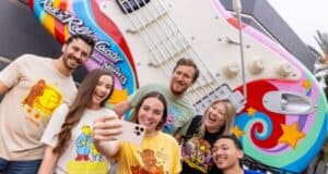 Fans pose for a selfie by the iconic Rock ‘n’ Roller Coaster guitar, pumped for Statler and Waldorf’s Muppets comeback.