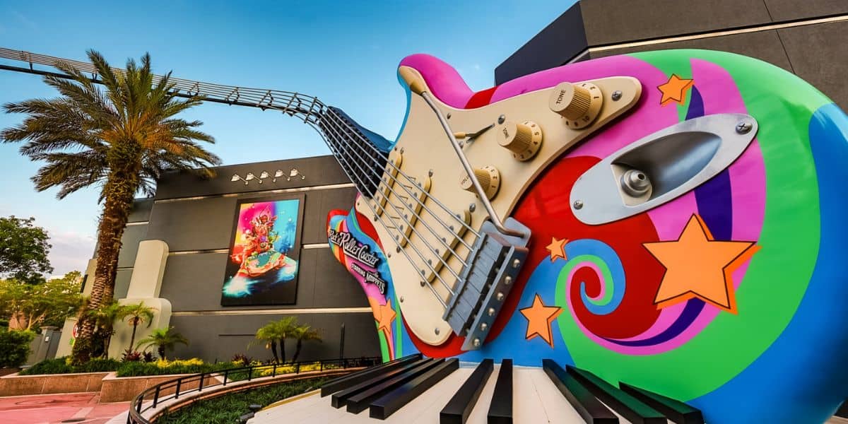 Giant, colorful guitar with stars marks the Rock 'n' Roller Coaster entrance as Statler & Waldorf return at Hollywood Studios.