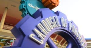 Vibrant Carousel of Progress sign at Disney World, shaped like blue gears, celebrating Walt Disney’s classic attraction.