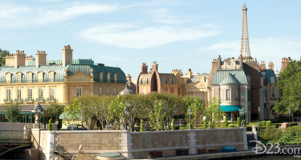 EPCOT’s France Pavilion waterfront with charming Parisian facades, lush gardens, and the Eiffel Tower replica rising behind.