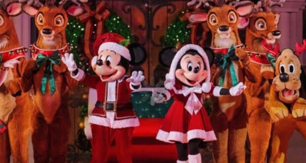 Mickey and Minnie Mouse join Pluto and reindeer in sparkling holiday attire amid festive decorations at Disney parks.