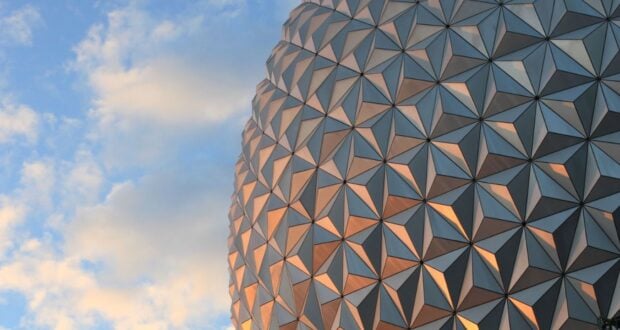 Spaceship Earth against a cloudy sky.