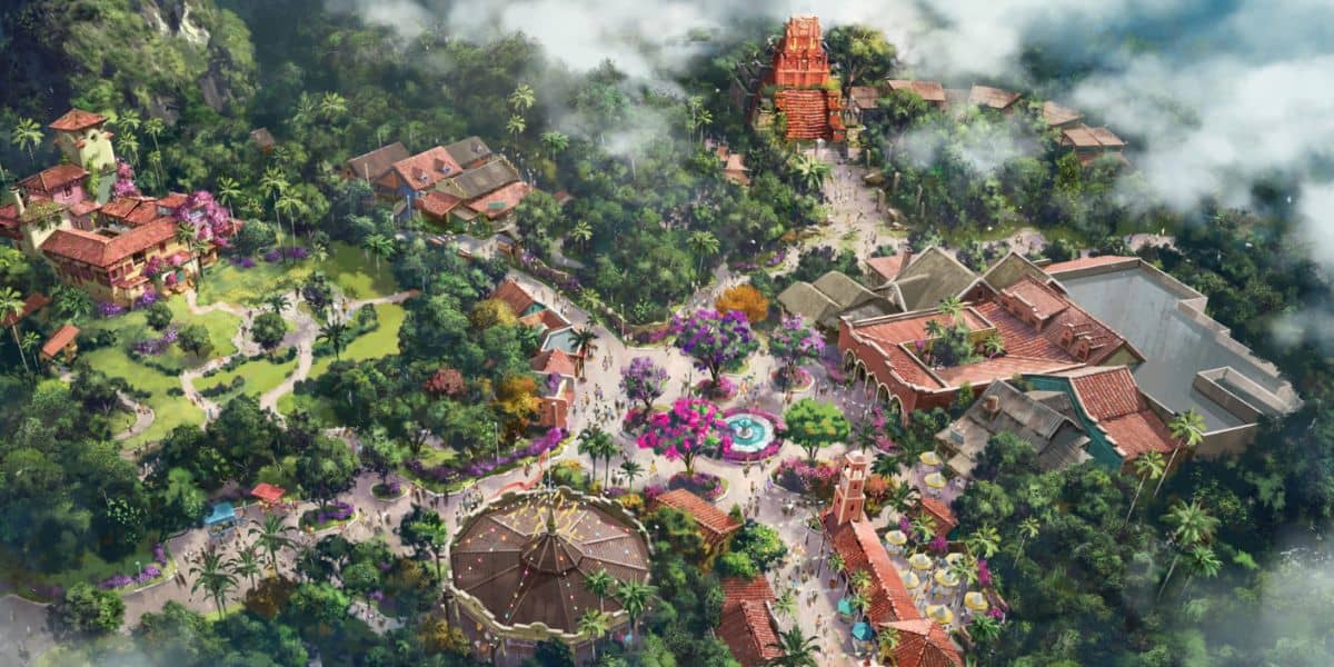 Aerial view of a vibrant, adventure-filled theme park with lush landscaping, winding paths, immersive buildings, and a prominent central fountain—showcasing thrilling new Tropical Americas rides inspired by Disney’s Animal Kingdom.