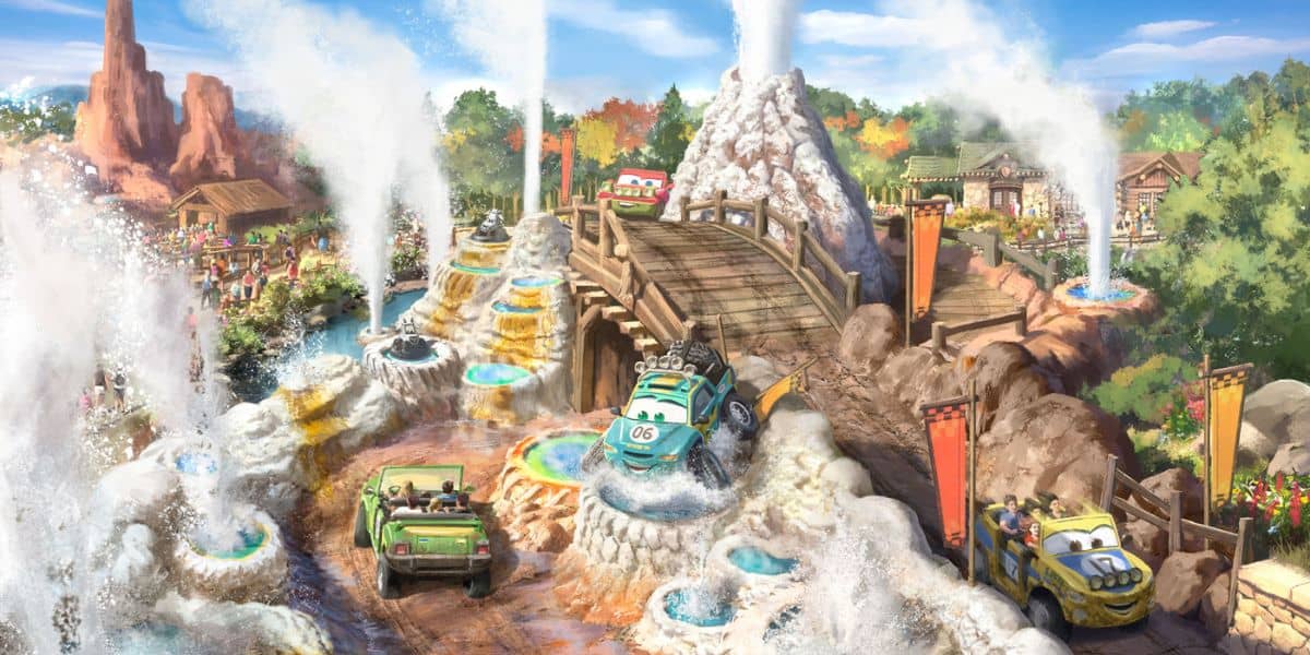 Radiator Springs Racers cars speed along a thrilling water track, dodging bursts from geysers and zipping past a scenic bridge set in the heart of Cars Land’s rugged, rocky desert landscape.