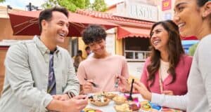 Disneyland guests eating at a table