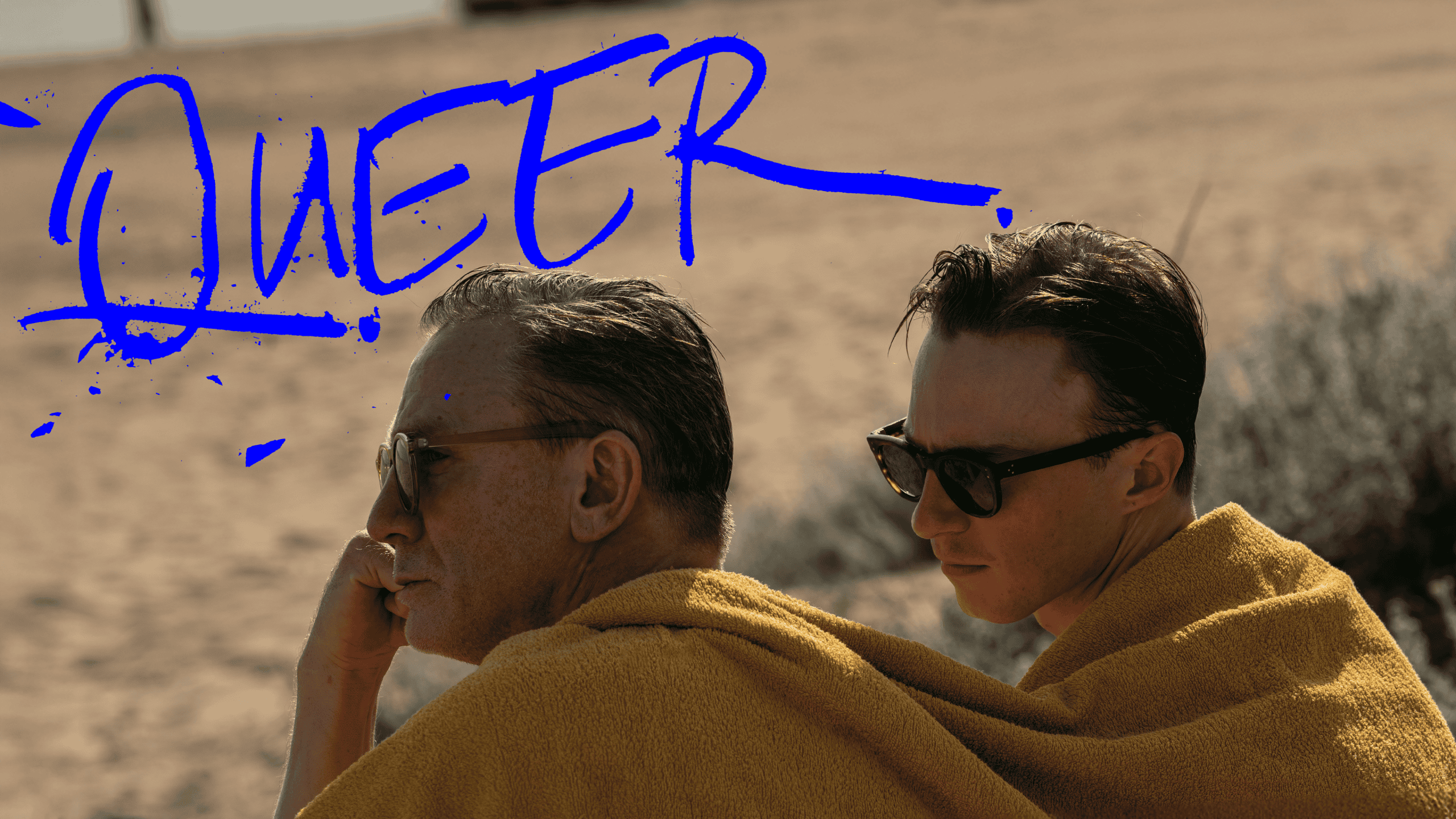 Sunset over a beach with two men wearing sunglasses and yellow towels, showcasing relaxed summer vibes, perfect for promoting vacation, summer, and leisure lifestyle content.