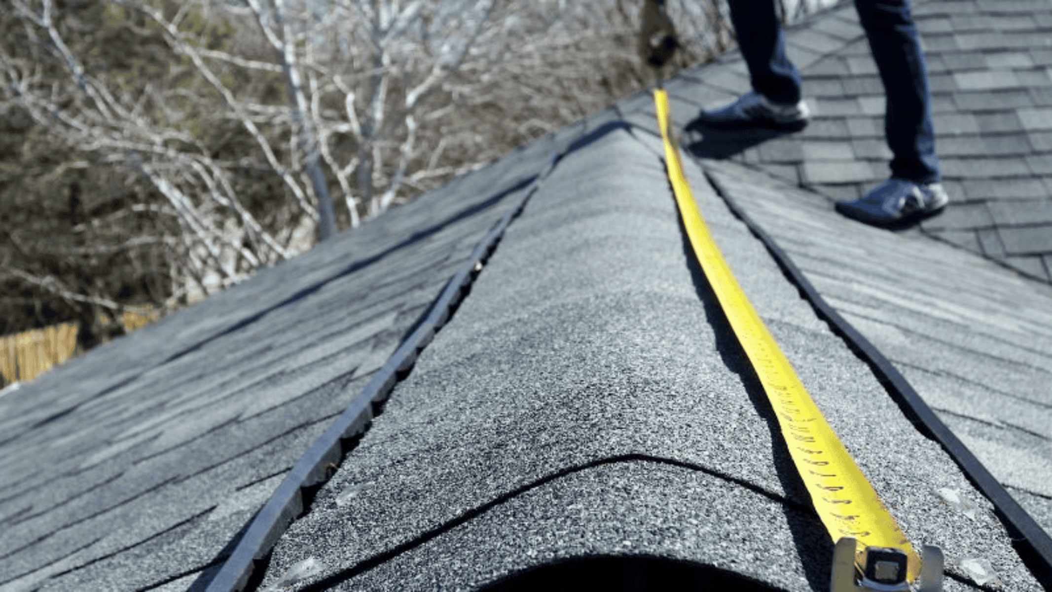 Dolan Roofing & Construction roofing contractor in a process of roof measurement for roof repairs in San Antonio, TX