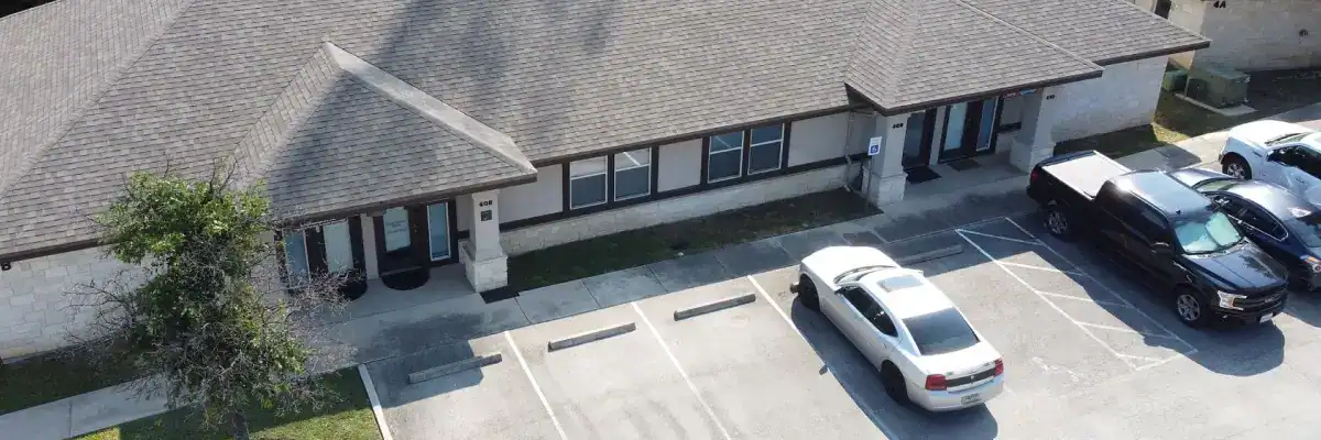Cedar Park roof replacement with new asphalt shingles on office building by Dolan Roofing & Construction in San Antonio