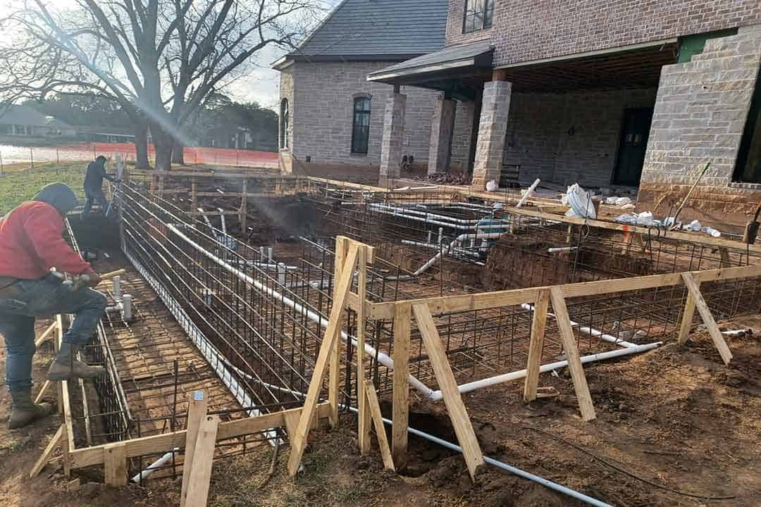 PVC plumbing stub outs within steel rebar pool frame