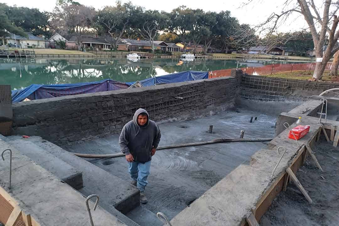 Fresh gunite applied to in-ground pool shell