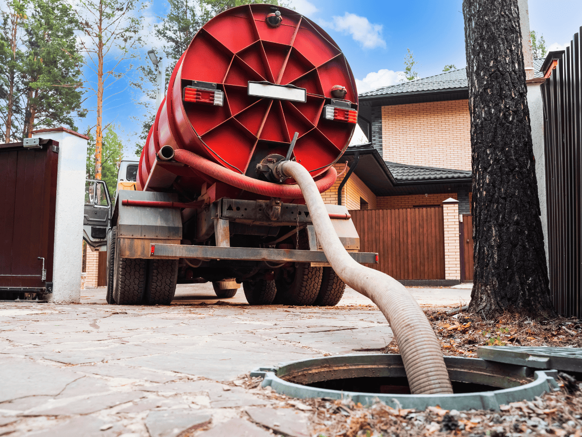 Drain Bros llc provides septic tank cleaning service at a home, showing routine care needed after system installation.