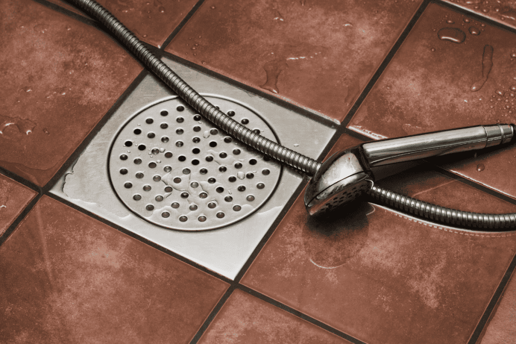 Drain Jetters R Us team ensuring smooth drainage in a basement floor drain.