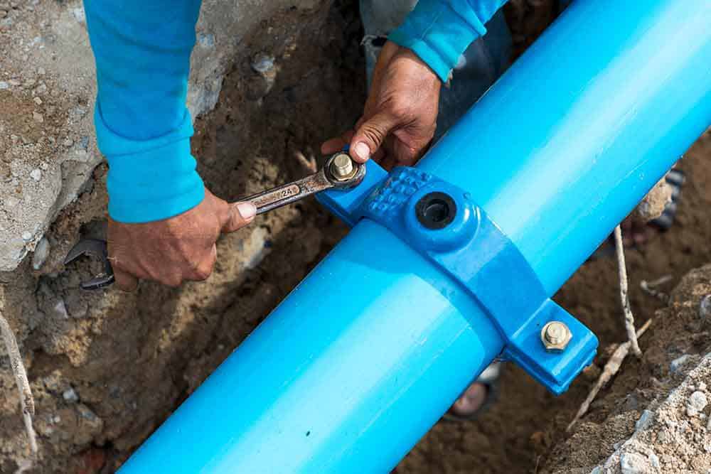 Team performing drain line maintenance