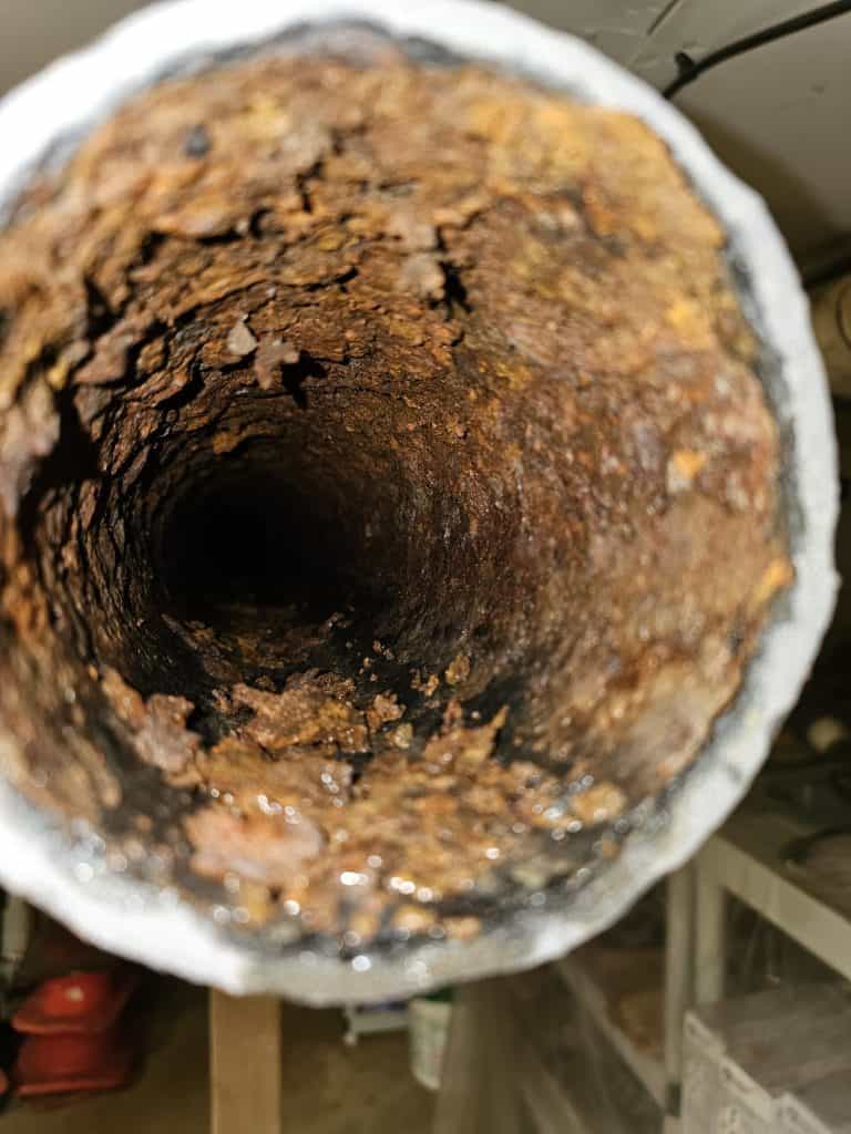 Close-up image of clogged drain during a drain inspection