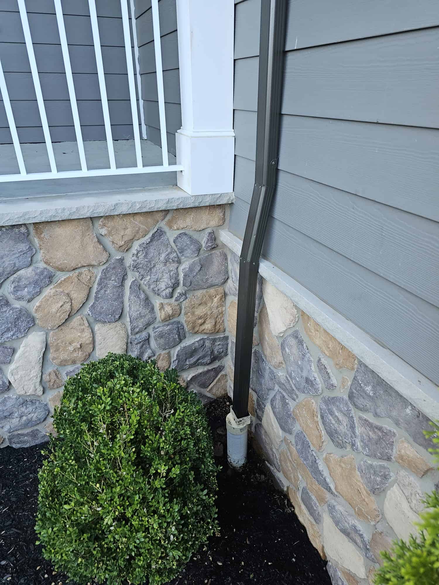 Drain Jetters R Us professionals installing gutters to prevent surface water accumulation.