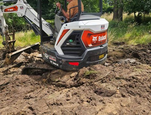 Drain Jetters R Us excavation equipment preparing a site for sewer line repair.