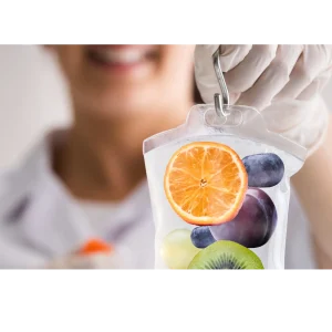 Gloved hand holding fruit infusion bag.