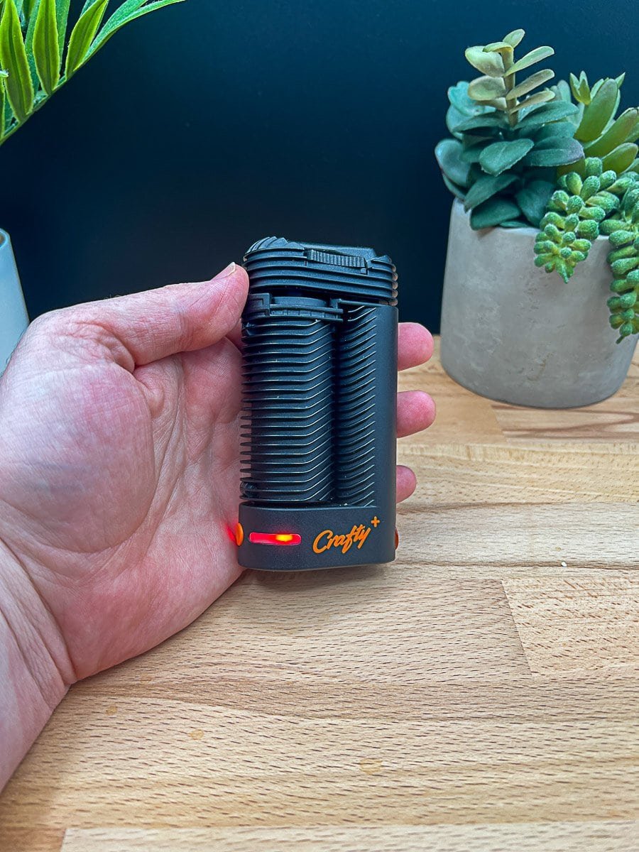 Crafty+ (Plus) portable dry herb vaporizer by Storz & Bickel with red LED light on – featured in Crafty+ Review 2025
