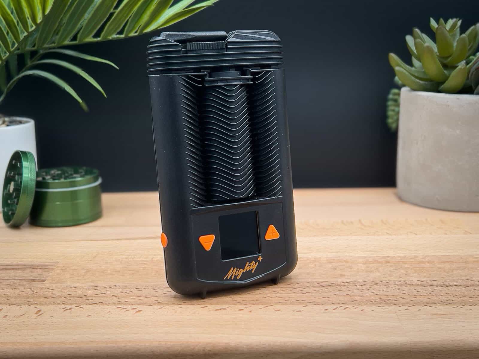Mighty+ vaporizer on a table – sleek design, hybrid heating, and precision temperature control for premium vaping.