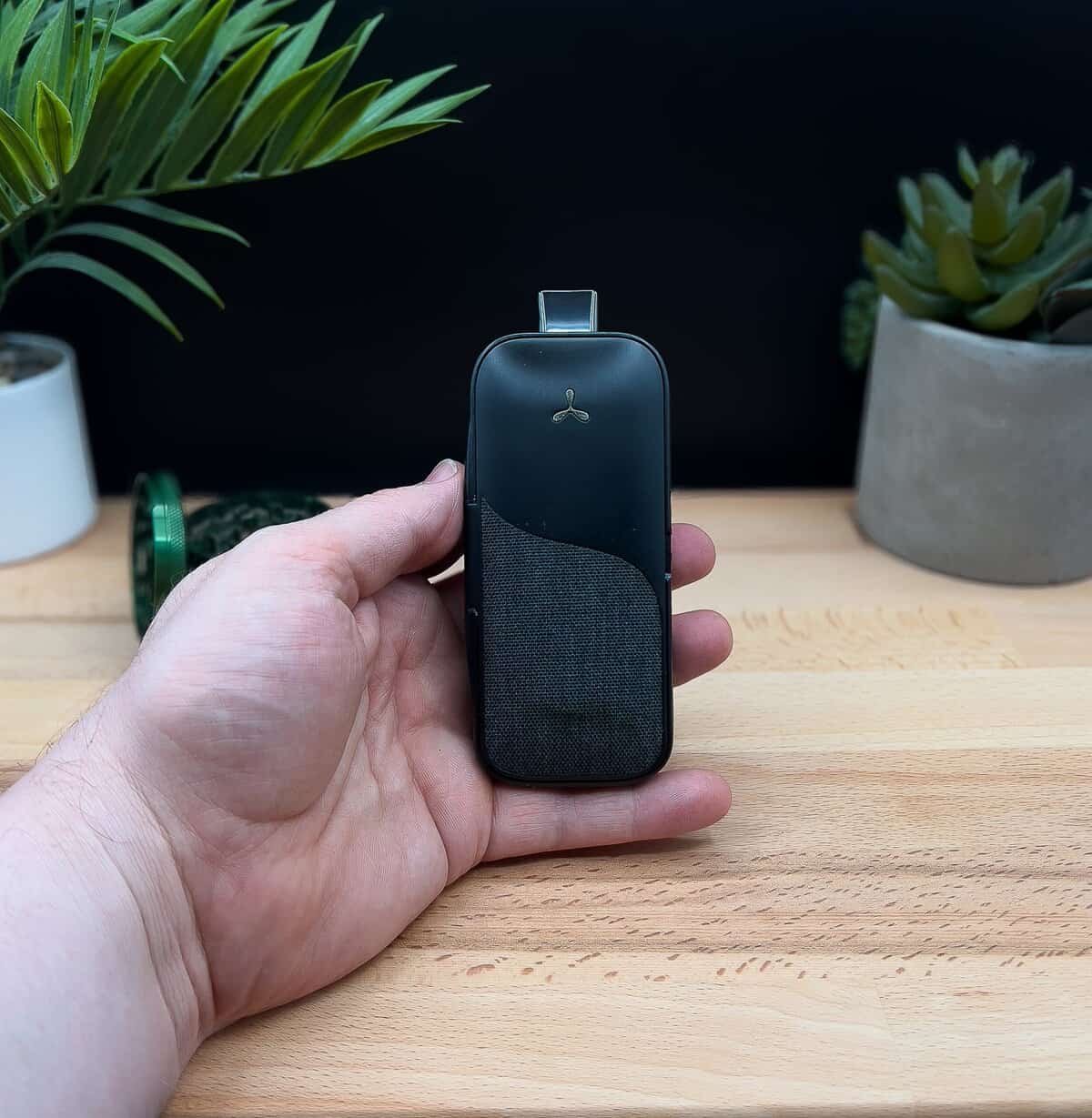 AirVape Legacy Pro review – ergonomic design showcased as the device is comfortably held in hand, highlighting its premium build and portability.