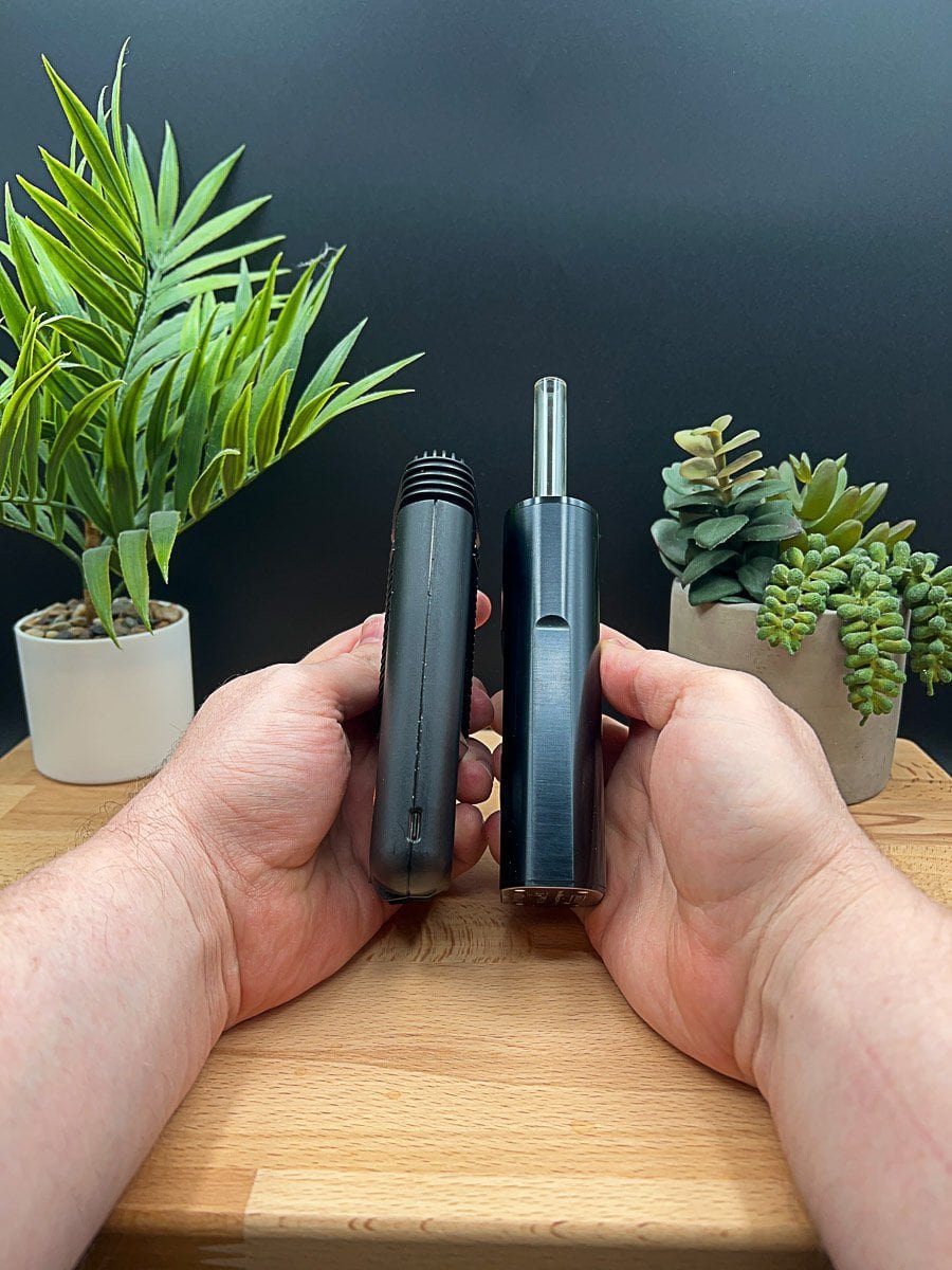 Hands holding the Mighty+ (Plus) and Arizer Solo 3 portable vaporizers side‑by‑side, highlighting design, size, and mouthpiece differences.