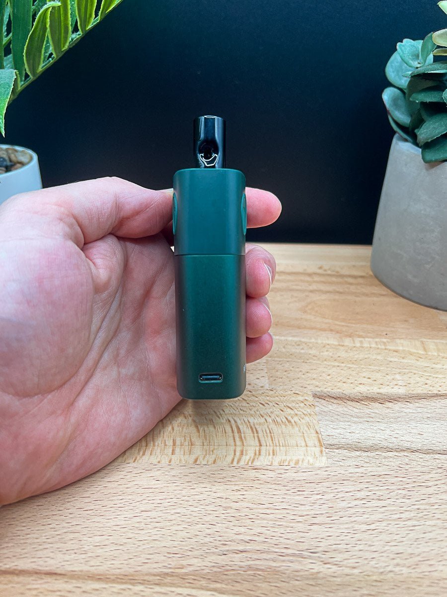 USB-C charging port on POTV Lobo vaporizer base – close-up with hand and natural backdrop for 2025 review