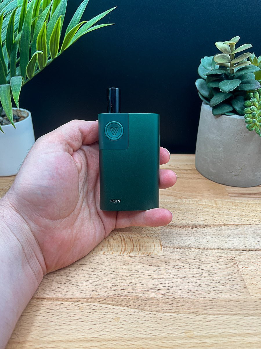 Hand holding POTV Lobo vaporizer with glass stem and black mouthpiece - 2025 review