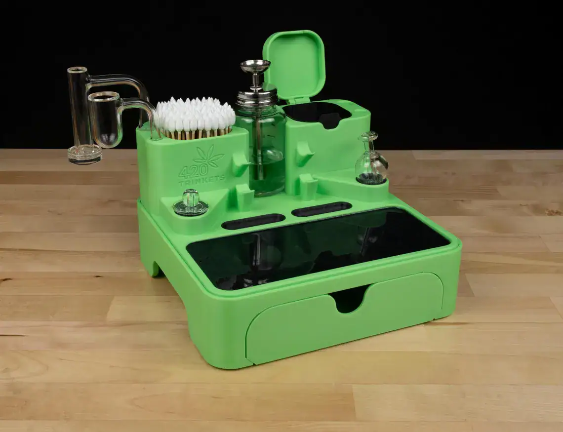 Concentration Station dab rig cleaning and display organizer in bright green with tool slots and drawer