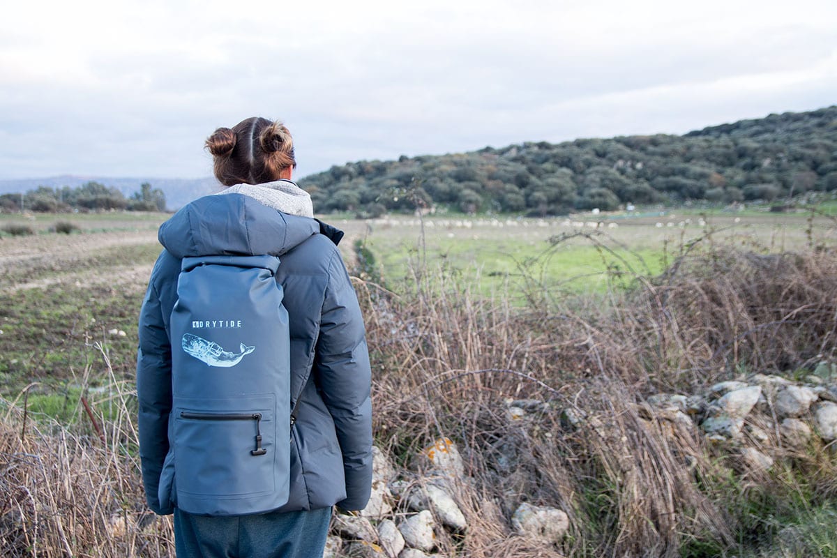 Woman wearing 30 liter DryTide waterproof backpack