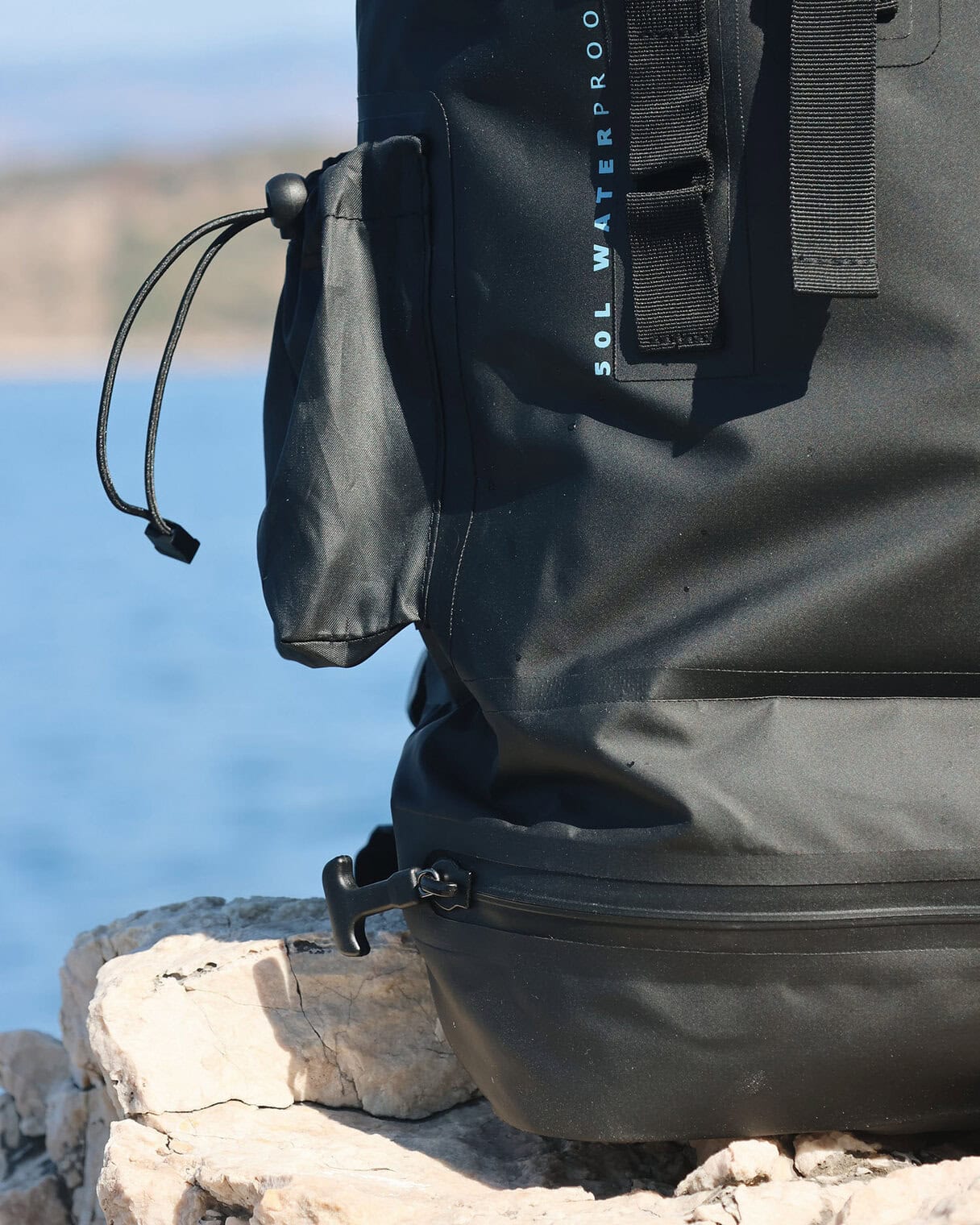 DryTide waterproof travel backpack with a waterproof bottom compartment accessible through an external zipper.