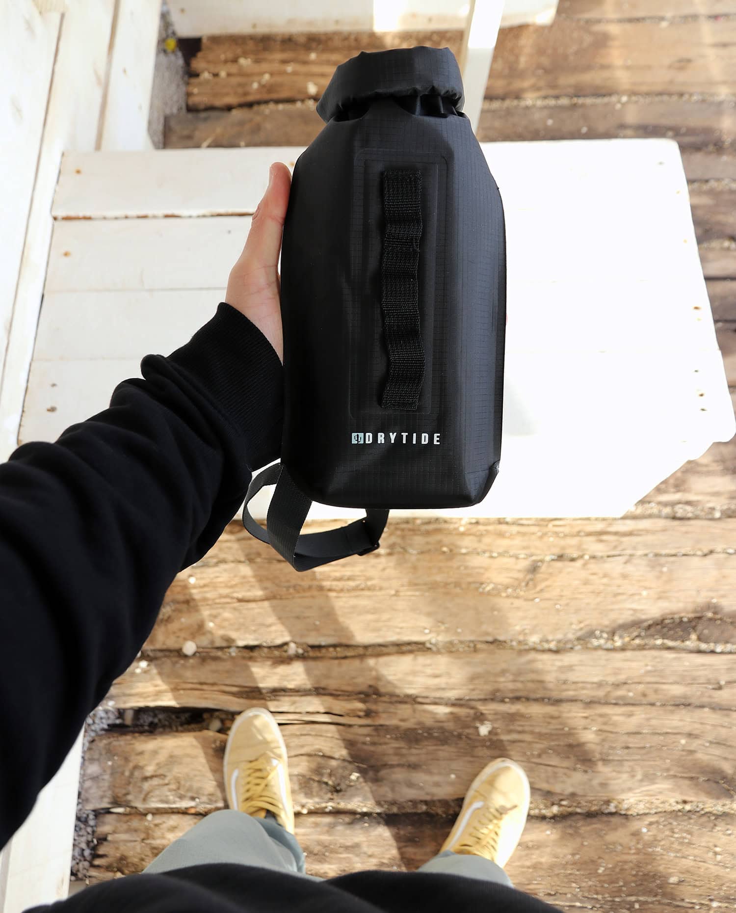 Holding Flat 2L dry bag for size reference