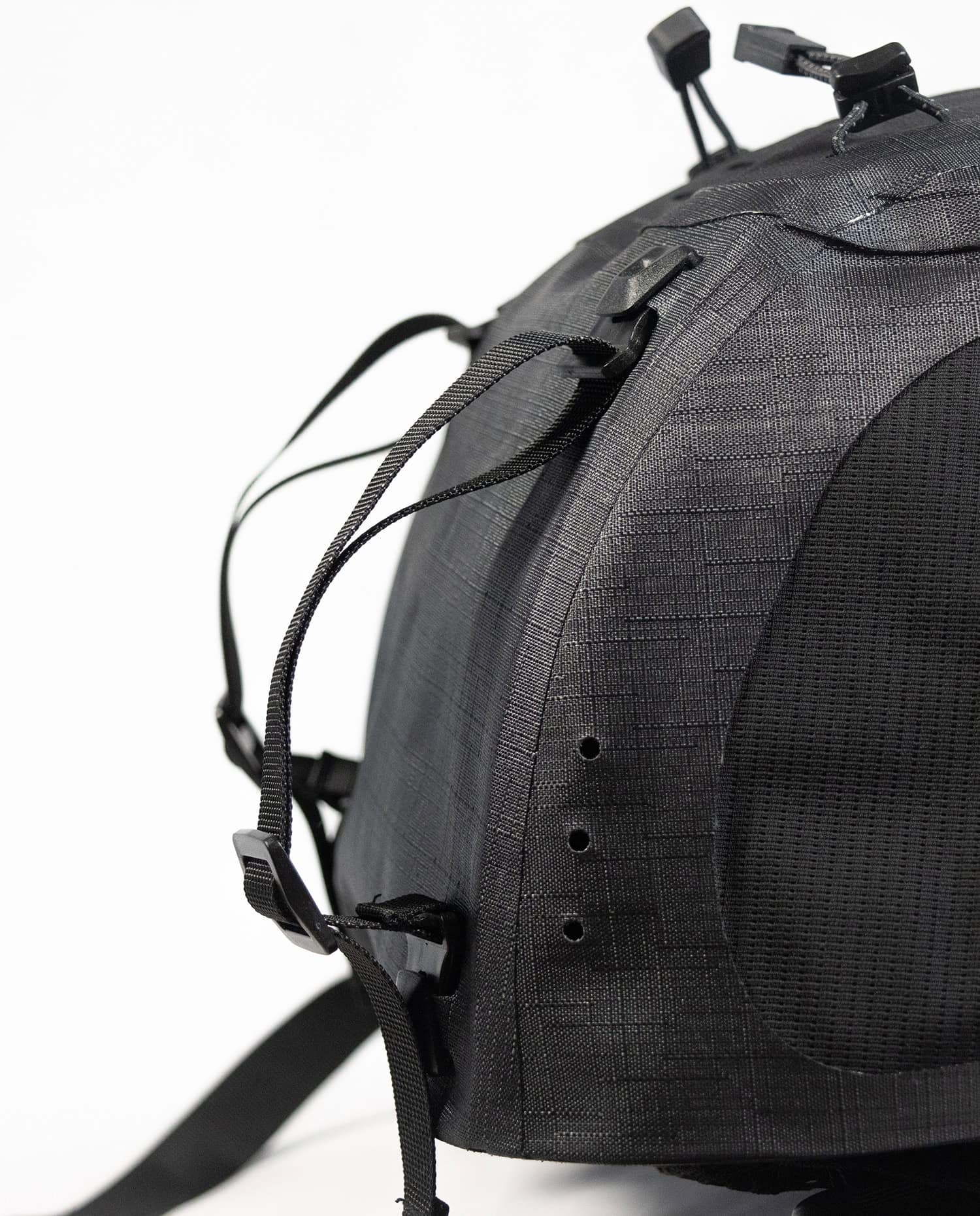 Black Drytide waterproof backpack with adjustable straps and secure closures.