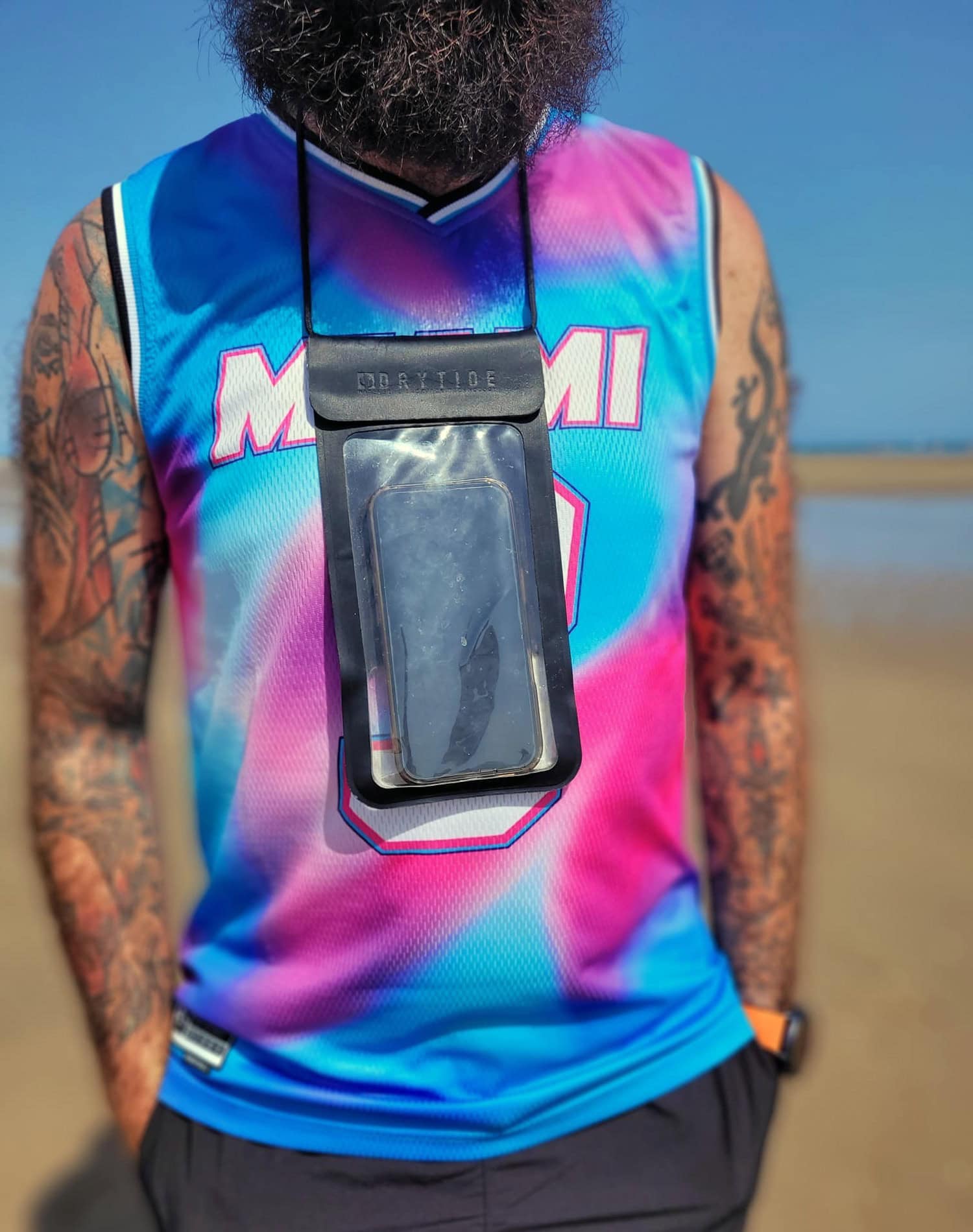 Waterproof phone bag worn around neck, ideal for beach, boating, and outdoor adventures.