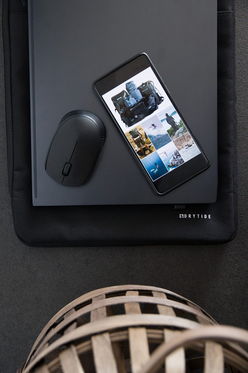 Laptop with laptop sleeve, mouse and phone