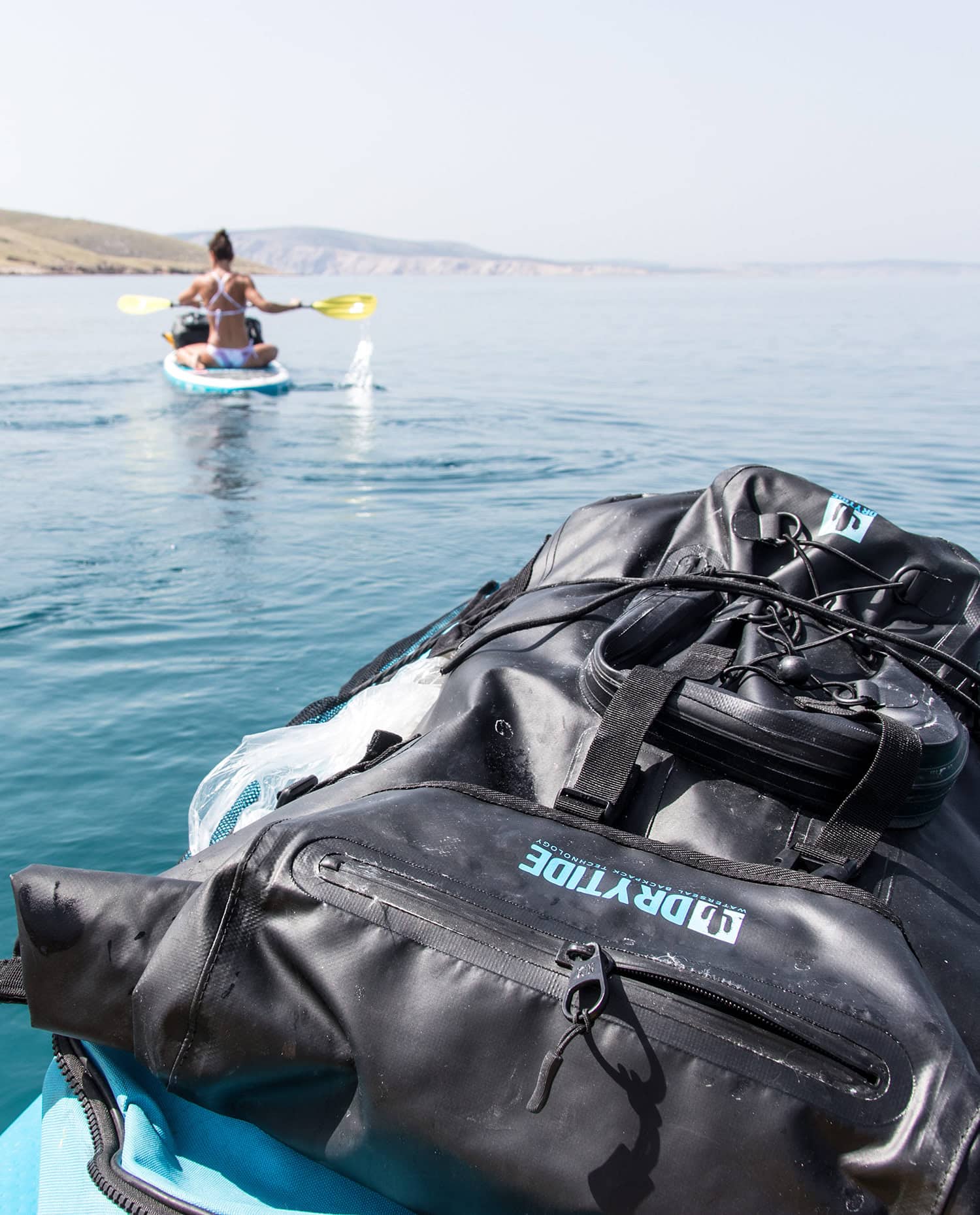 Waterproof 50L backpack with durable design, ideal for water adventures and outdoor travel.