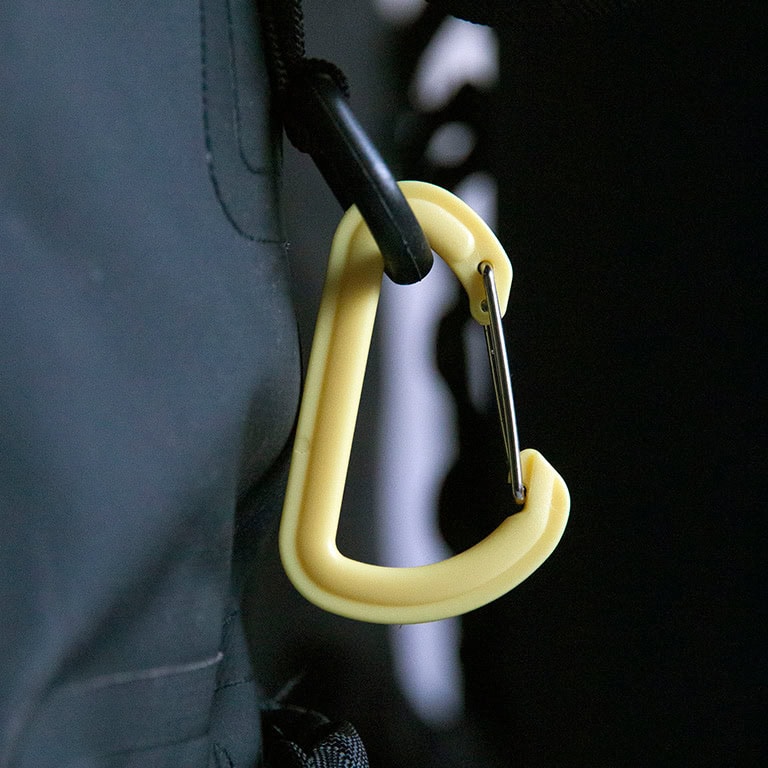 yellow plastic carabiner on drytide backpack square yellow plastic carabiner on drytide backpack square