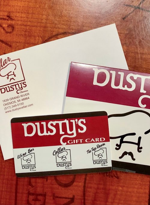 dustys gift cards on wooden table