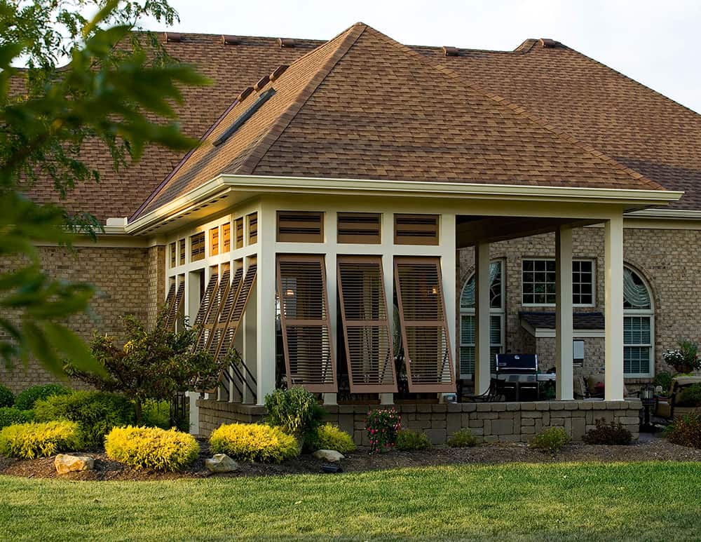 outdoor dining room with wooden shutters