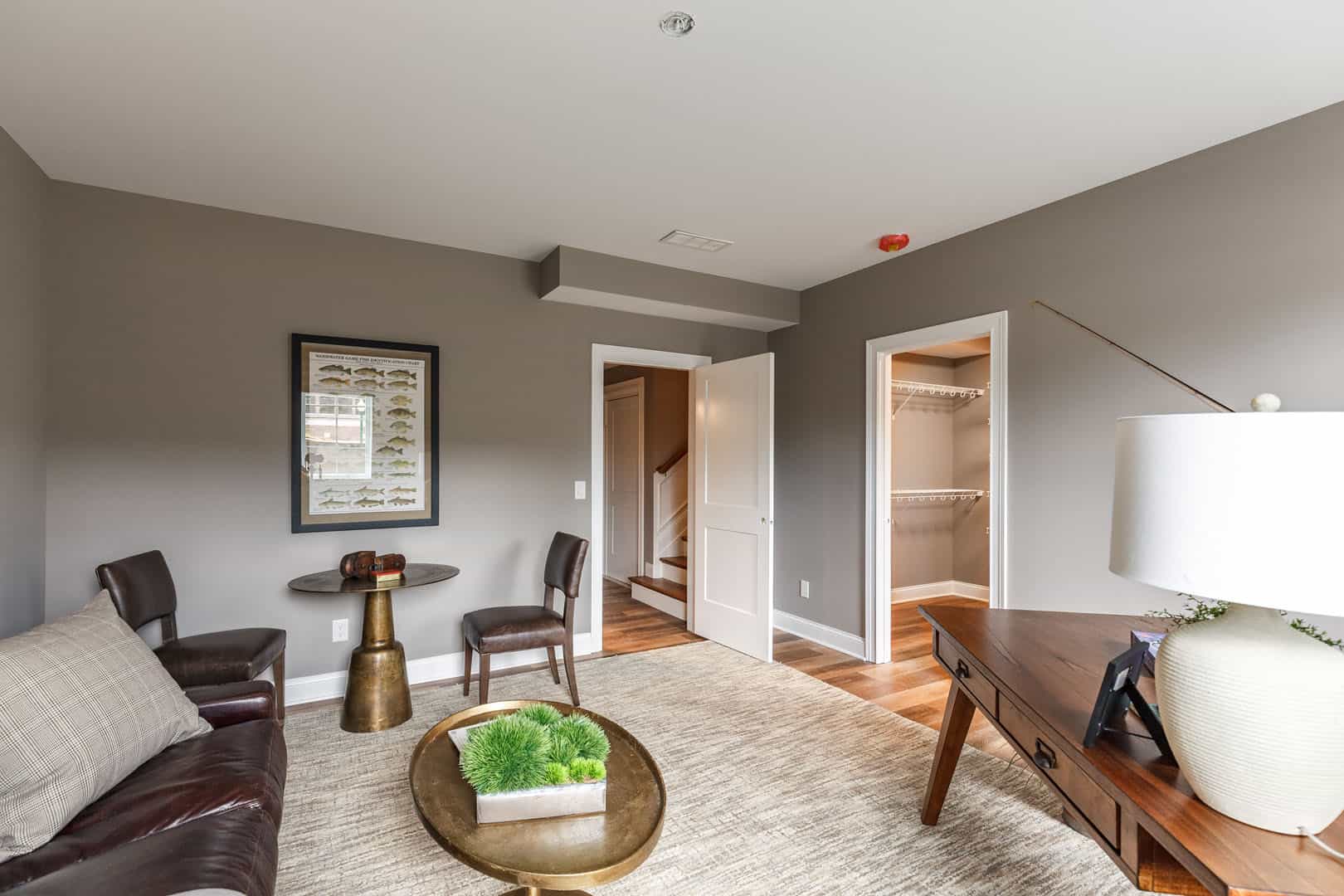 large home office with couch and walk in closet