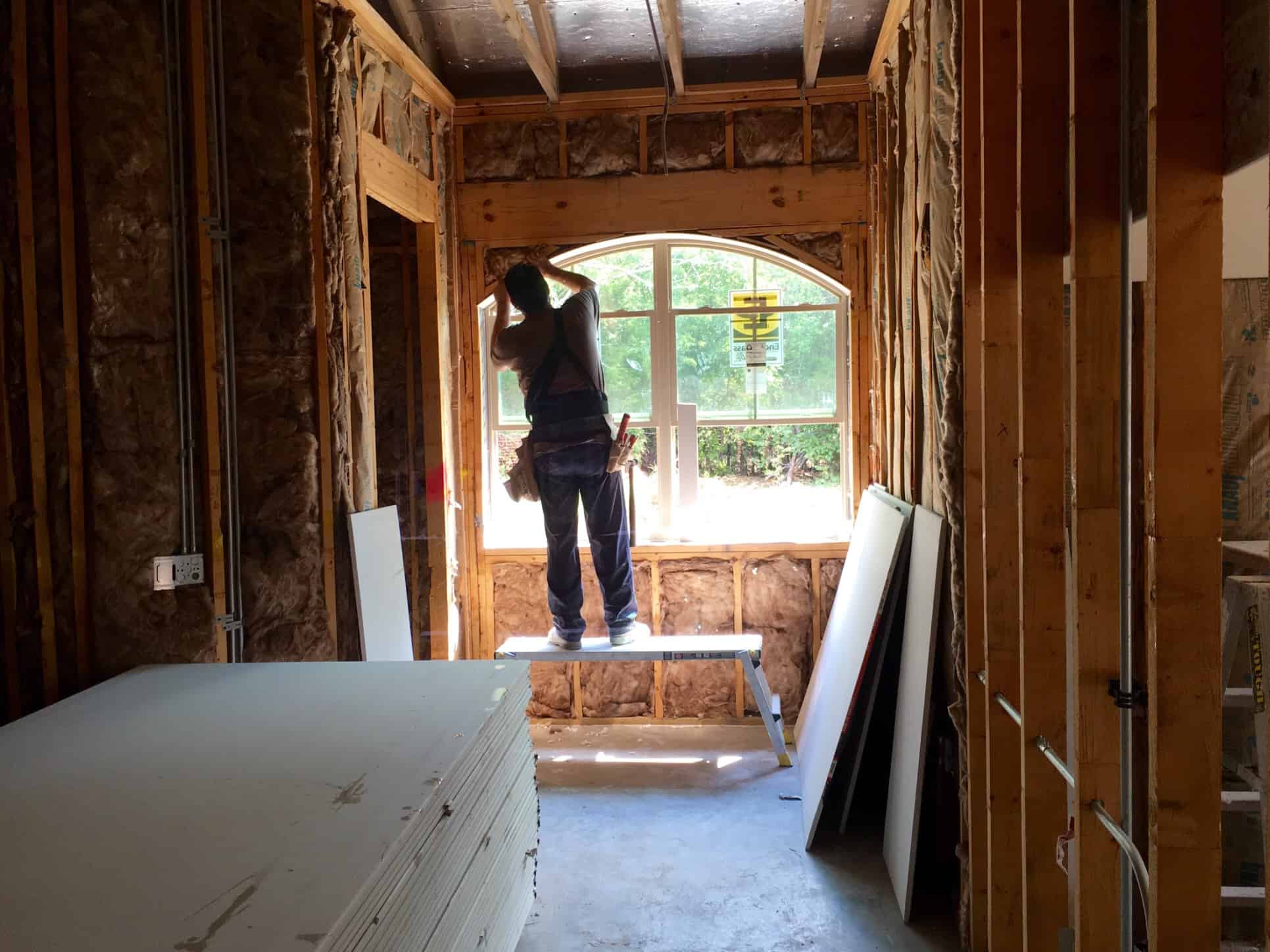 man installing a window