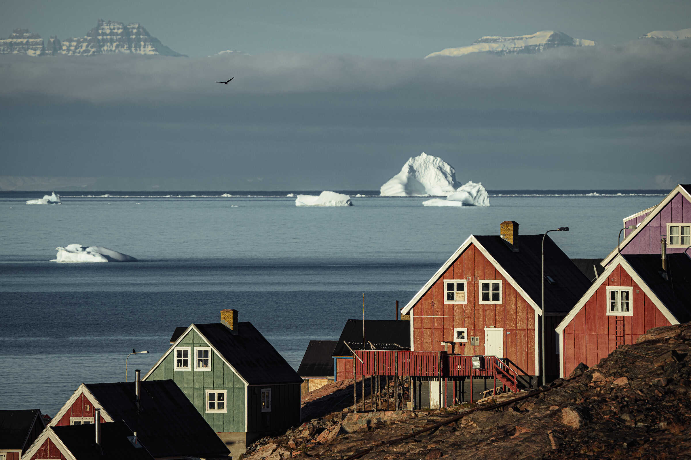 Ittoqqortoormiit Scoresbysund Houses Mountains. Photo by Jason Charles Hill - Visit Greenland